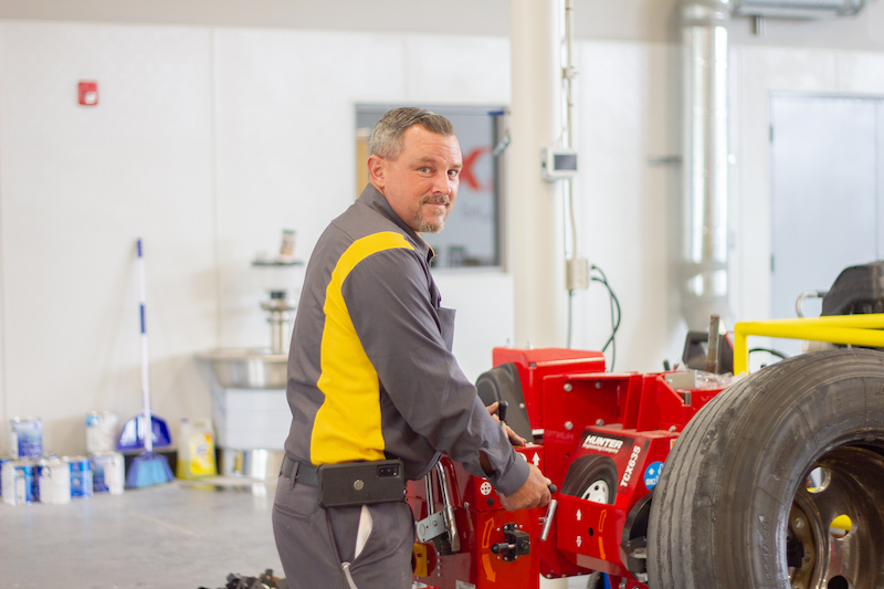 Trent working on a tire