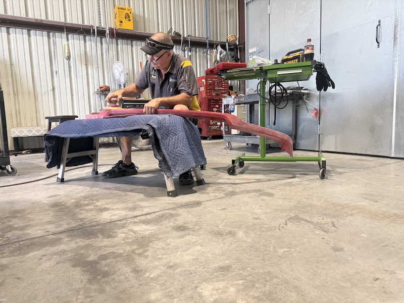 mechanic sitting down doing some work